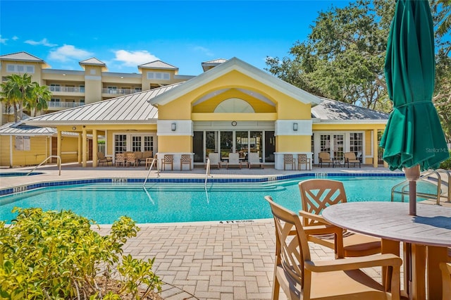 view of pool featuring a patio