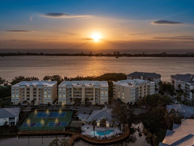 aerial view at dusk with a water view