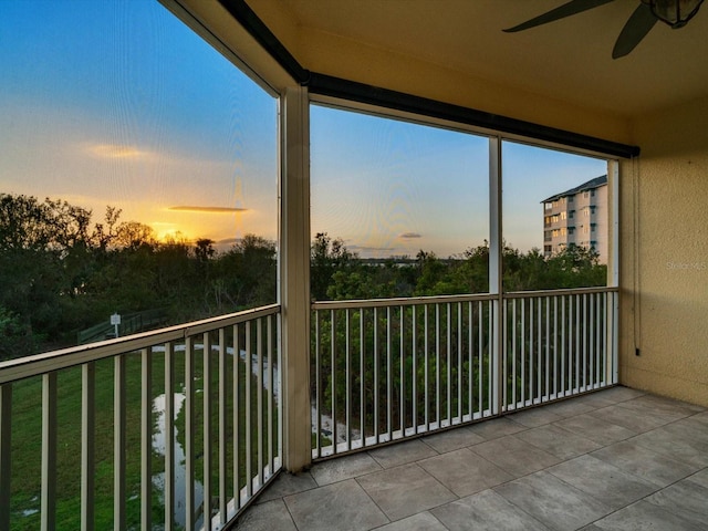 balcony at dusk with ceiling fan