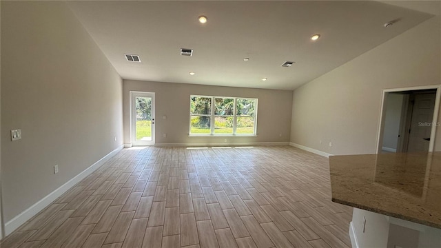 unfurnished room with visible vents, recessed lighting, baseboards, and light wood-type flooring
