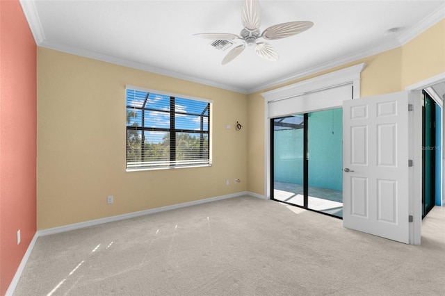 unfurnished bedroom with ceiling fan, light carpet, and crown molding