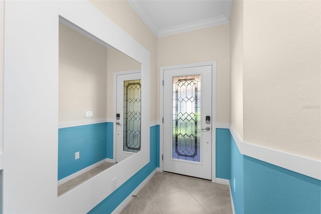 entryway featuring ornamental molding and light tile patterned floors