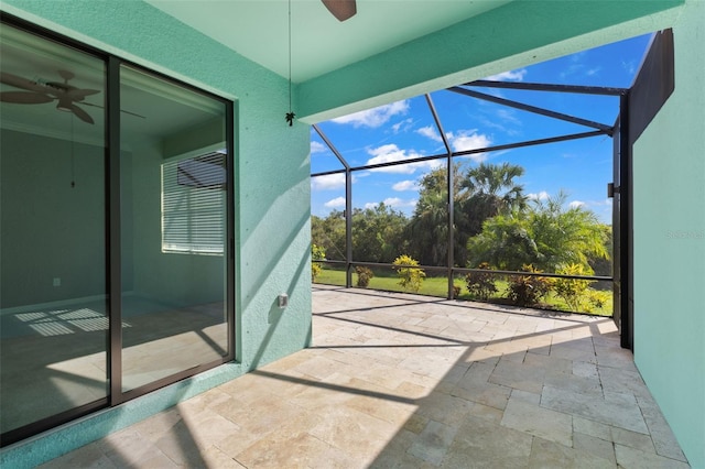 sunroom featuring ceiling fan