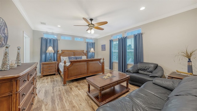 bedroom with ceiling fan, light wood-type flooring, and crown molding