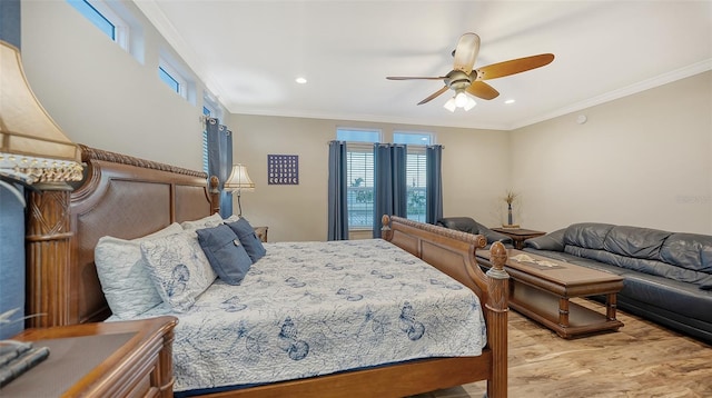 bedroom with ceiling fan, light hardwood / wood-style flooring, and ornamental molding