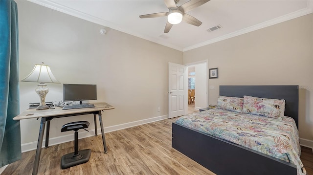 bedroom with light wood-type flooring, ceiling fan, and crown molding