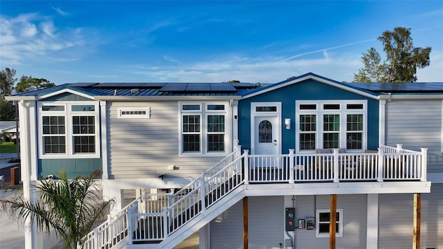 back of property with solar panels