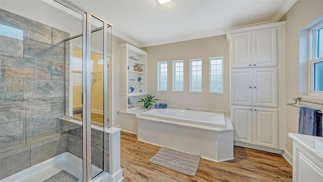 bathroom with crown molding, separate shower and tub, and hardwood / wood-style floors