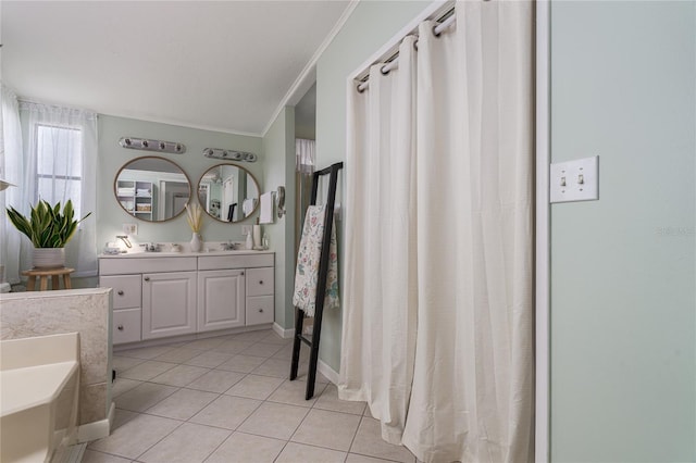 bathroom featuring ornamental molding, vanity, a bathing tub, and tile patterned floors