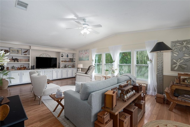 living room with vaulted ceiling, ceiling fan, light hardwood / wood-style flooring, and built in features