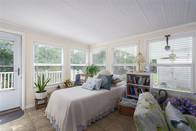 tiled bedroom with ornamental molding and wooden ceiling