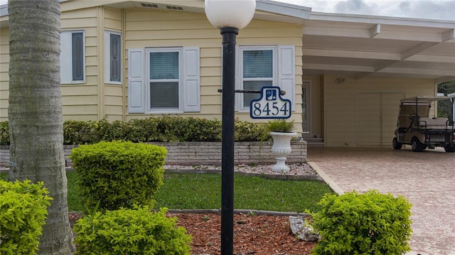 exterior space with a carport