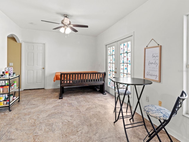 bedroom featuring ceiling fan and french doors