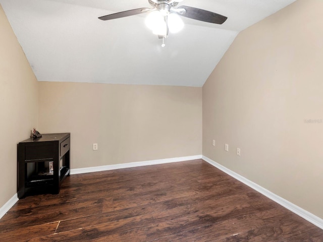 bonus room featuring vaulted ceiling, dark hardwood / wood-style flooring, and ceiling fan