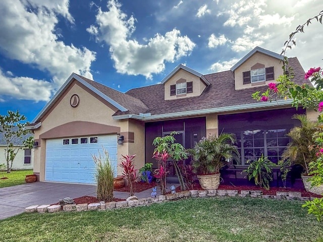 7209 49th Pl E, Palmetto, FL 34221 - view of front of property with a front lawn, a garage, driveway, and stucco siding