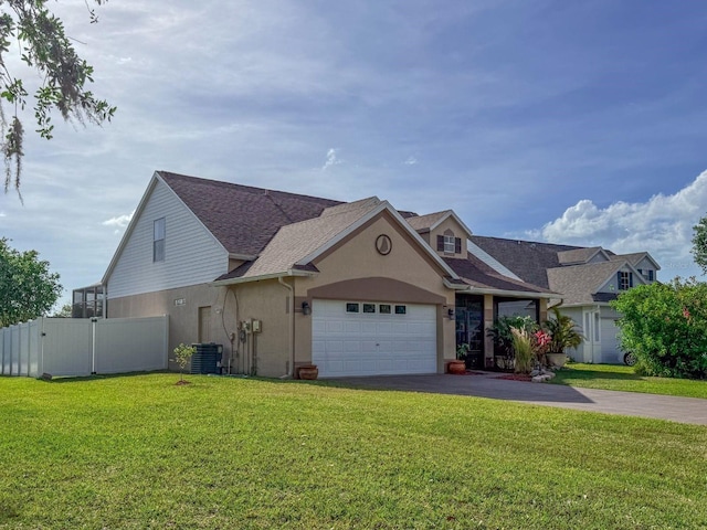 7209 49th Pl E, Palmetto, FL 34221 - traditional-style home with a garage, stucco siding, a front yard, fence, and driveway