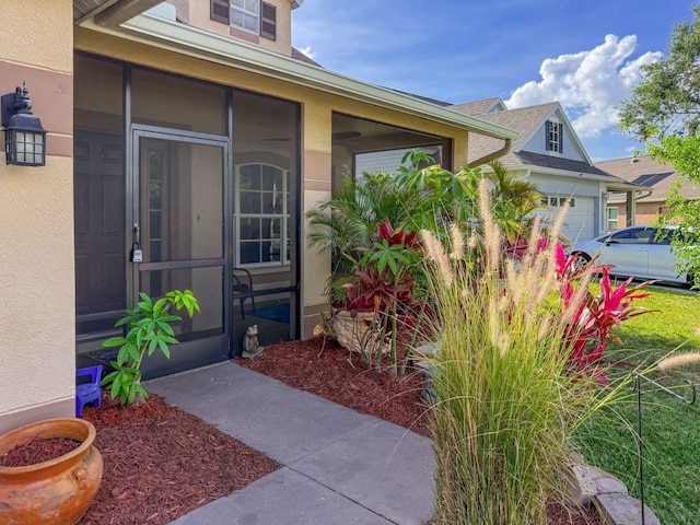 7209 49th Pl E, Palmetto, FL 34221 - entrance to property featuring an attached garage and stucco siding