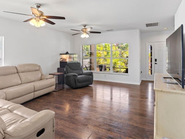 7209 49th Pl E, Palmetto, FL 34221 - living area with visible vents, baseboards, a ceiling fan, and wood finished floors