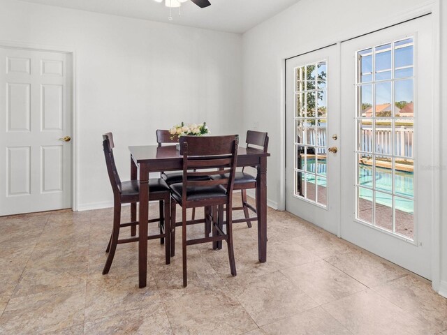 7209 49th Pl E, Palmetto, FL 34221 - dining space featuring baseboards, a ceiling fan, and french doors