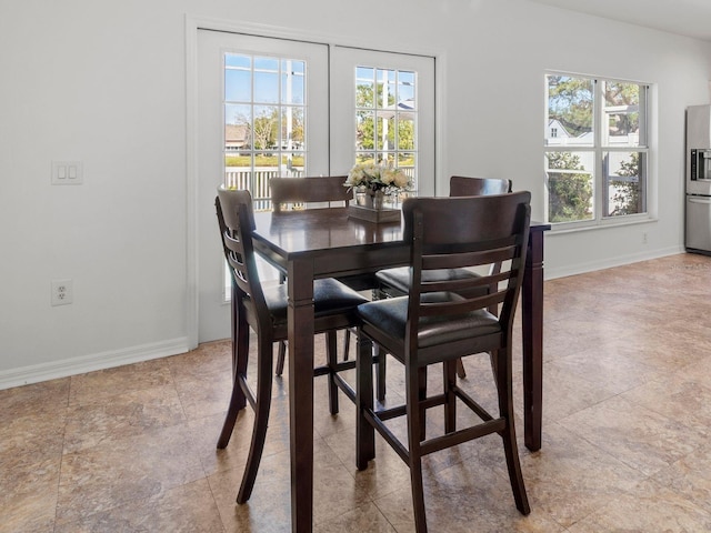 7209 49th Pl E, Palmetto, FL 34221 - dining room featuring baseboards and a healthy amount of sunlight
