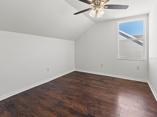 7209 49th Pl E, Palmetto, FL 34221 - additional living space with dark wood-style flooring, baseboards, a ceiling fan, and vaulted ceiling