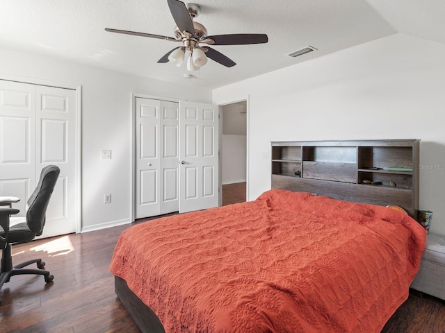 7209 49th Pl E, Palmetto, FL 34221 - bedroom with baseboards, visible vents, dark wood-style flooring, and multiple closets