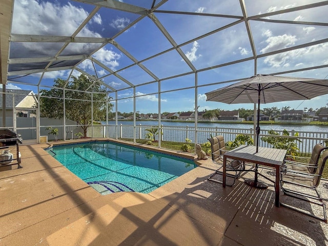 7209 49th Pl E, Palmetto, FL 34221 - view of swimming pool with a water view, glass enclosure, a patio area, fence, and a fenced in pool