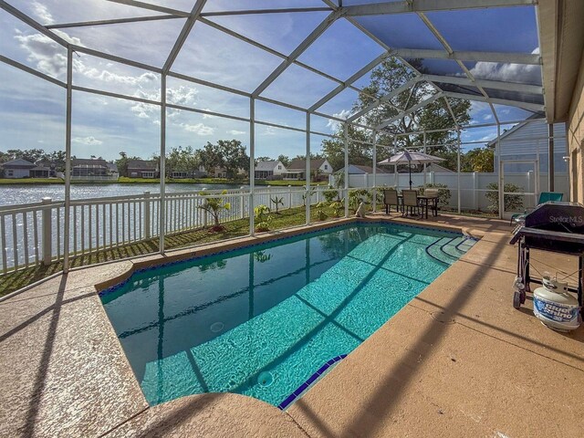 7209 49th Pl E, Palmetto, FL 34221 - view of pool featuring a water view, a patio area, a fenced backyard, and a fenced in pool