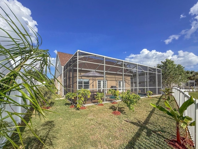7209 49th Pl E, Palmetto, FL 34221 - back of property with a pool, fence, and a lanai