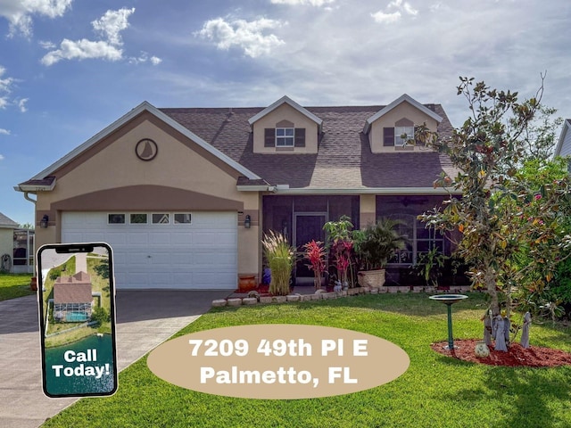 7209 49th Pl E, Palmetto, FL 34221 - view of front of property featuring a shingled roof, a front lawn, stucco siding, an attached garage, and driveway