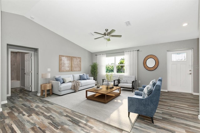 living room featuring dark hardwood / wood-style floors, ceiling fan, and lofted ceiling