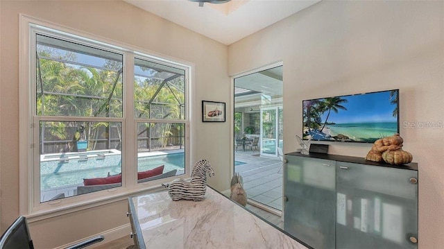 doorway to outside featuring baseboards
