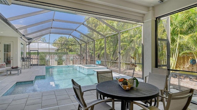 view of swimming pool with a lanai, a patio, outdoor dining space, and a pool with connected hot tub