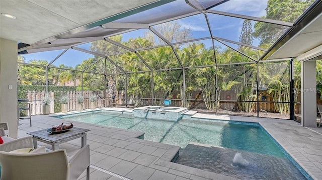 view of swimming pool with a patio, glass enclosure, and an in ground hot tub