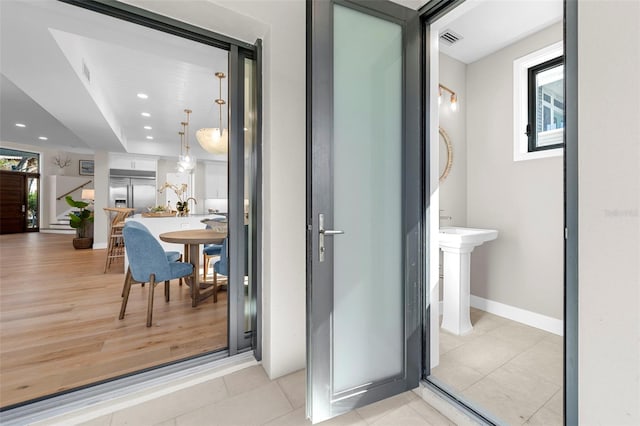 bathroom featuring hardwood / wood-style floors and a healthy amount of sunlight