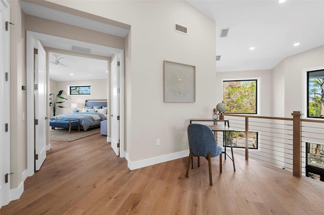 office featuring ceiling fan and light wood-type flooring