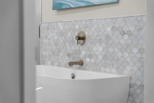 bathroom with tile walls