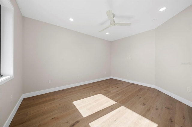 unfurnished room featuring hardwood / wood-style flooring and ceiling fan