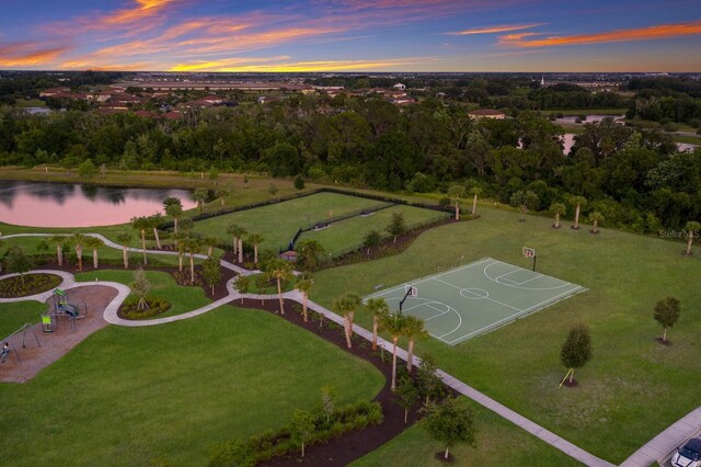 aerial view at dusk with a water view