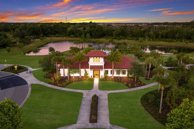 aerial view at dusk with a water view