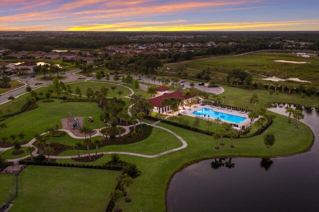 aerial view at dusk with a water view