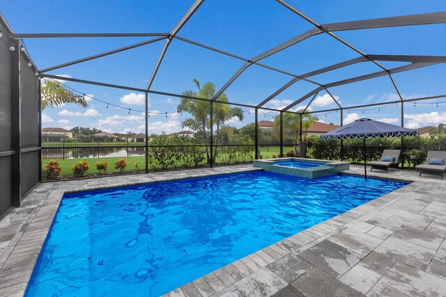 view of swimming pool featuring a patio, a water view, an in ground hot tub, and glass enclosure