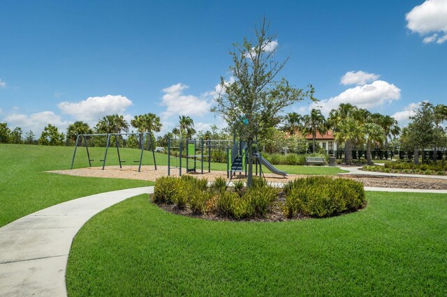 exterior space with a playground and a yard