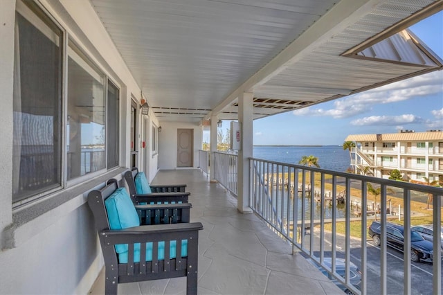 balcony featuring a water view