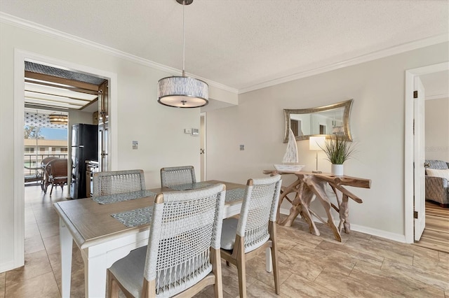 dining space featuring crown molding and a textured ceiling