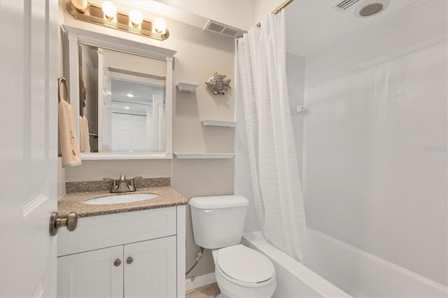 full bathroom featuring vanity, shower / bath combo, and toilet