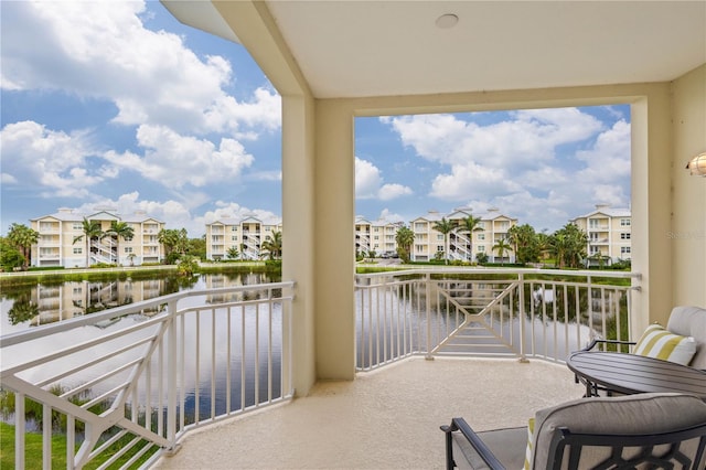 balcony featuring a water view