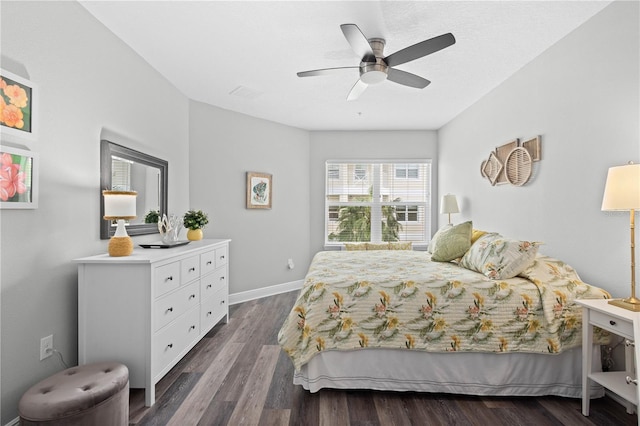 bedroom featuring ceiling fan and dark wood-type flooring