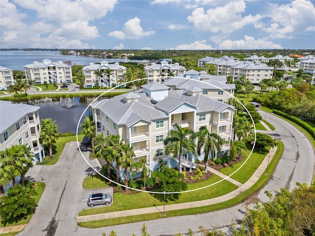 birds eye view of property featuring a water view