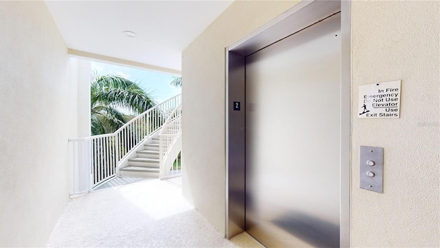 property entrance featuring a balcony and elevator